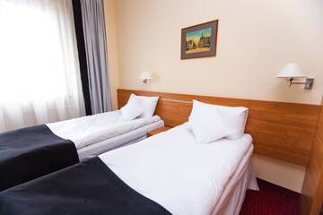 Фото номера Двухместный номер с 2 отдельными кроватями Отель Hotel Malinowski Business г. Гливице 4